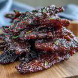 Savory beef jerky infused with sweet black currant BBQ sauce and finished with cherry wood smoke for a rich, smoky flavor.  