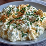 High-protein cottage cheese scrambled eggs served steaming hot with fresh chives.