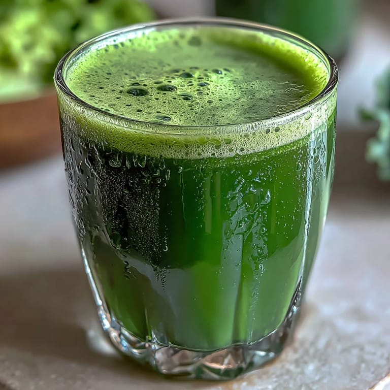 Refreshing Cabbage and Kale Detox Juice poured into a glass, ready to enjoy.