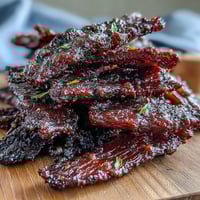 Savory beef jerky infused with sweet black currant BBQ sauce and finished with cherry wood smoke for a rich, smoky flavor.  